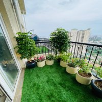 Balcony setup with wooden flooring
