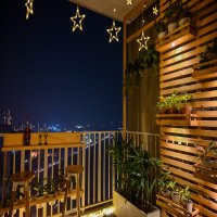 Modern balcony with swing and railing table